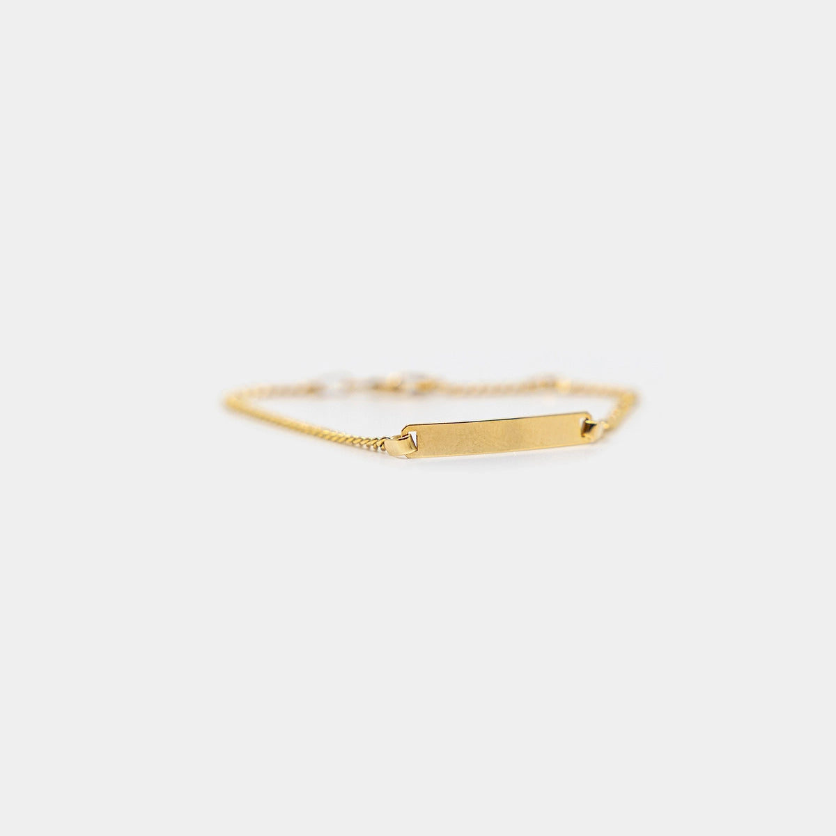 Pansararmband med bricka
